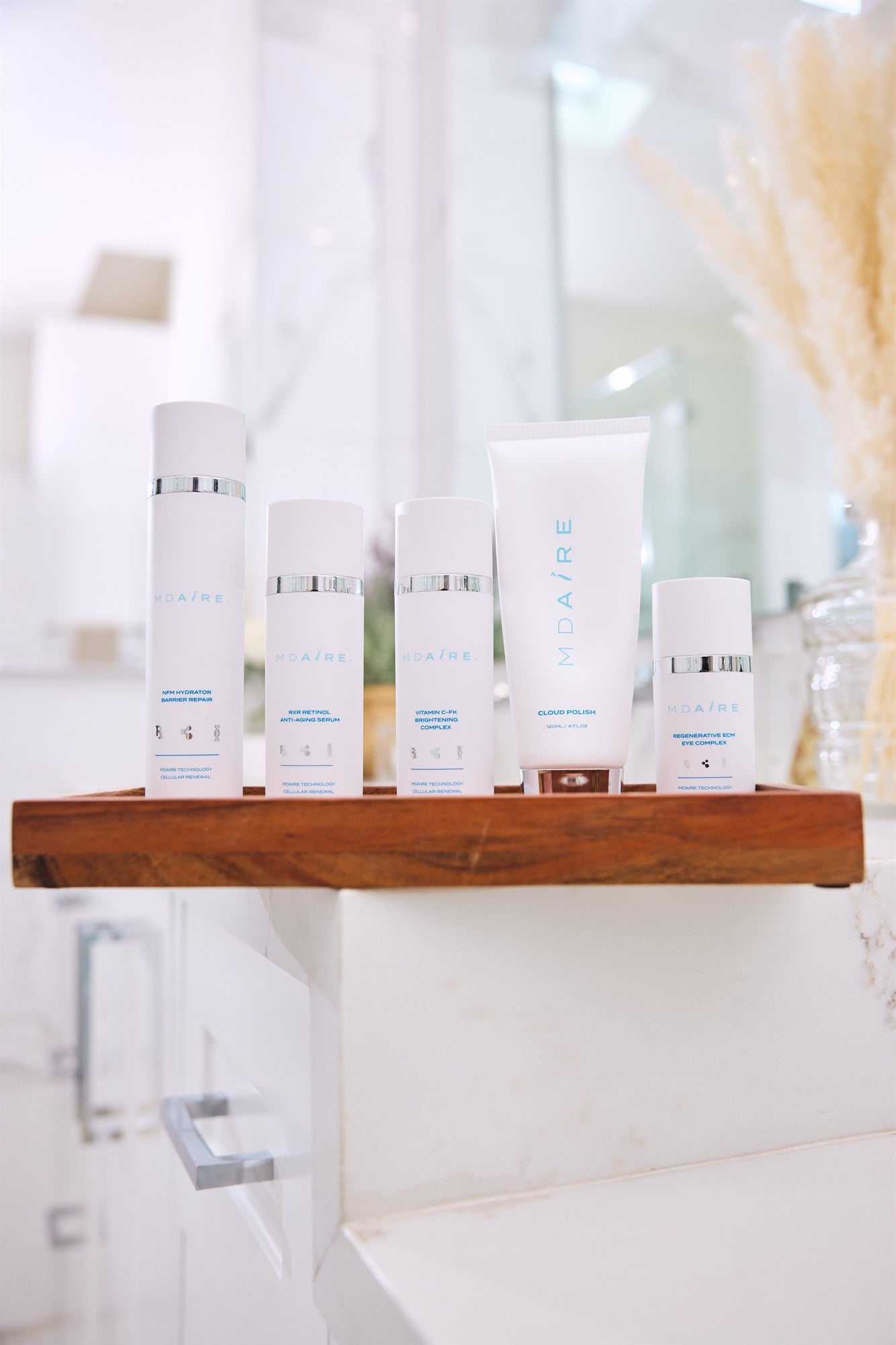 MDAiRE skincare bundle on bathroom counter