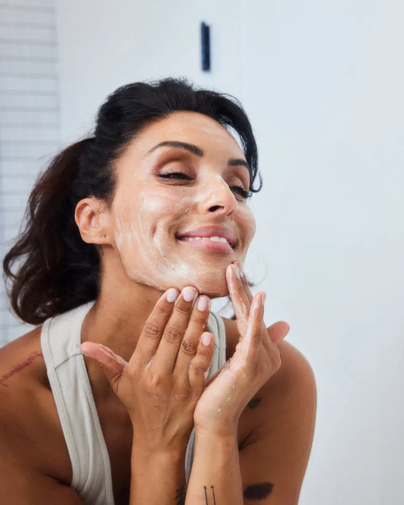 Get Started Bundle featuring woman gently applying cleanser in gallery