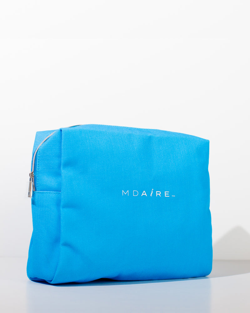 MDAiRE Cosmetic Bag in vibrant blue with logo on front, waterproof design, displayed in gallery position 1