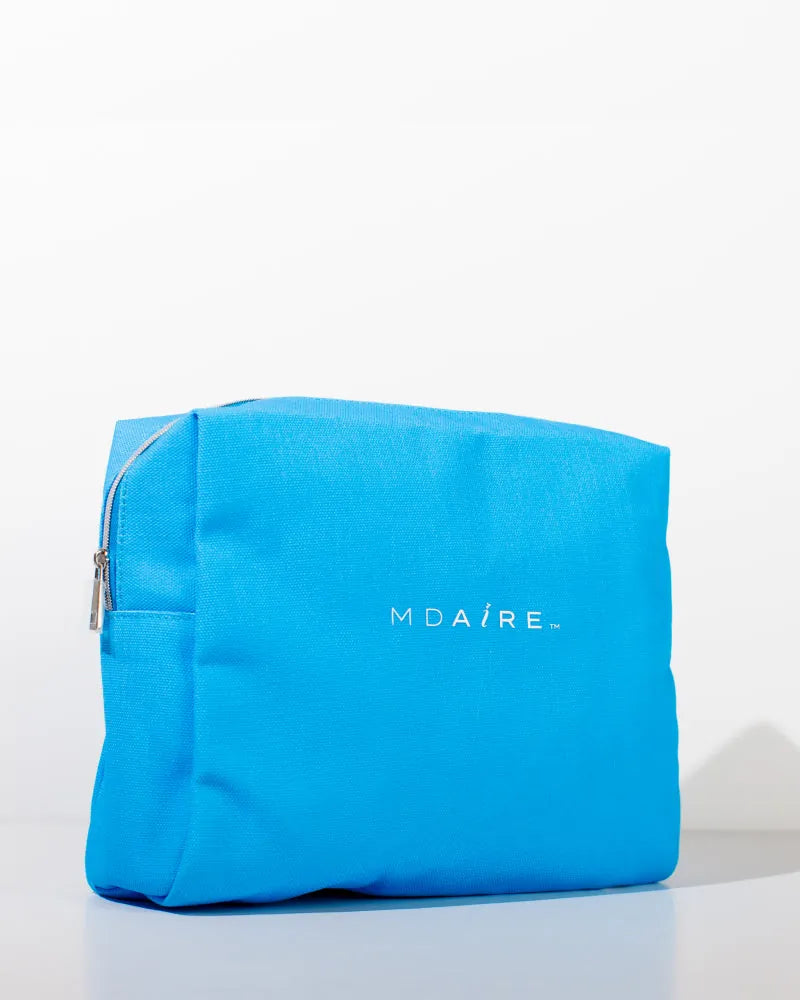 Bright blue MDAiRE cosmetic bag featured in the Glow on the Go Bundle 