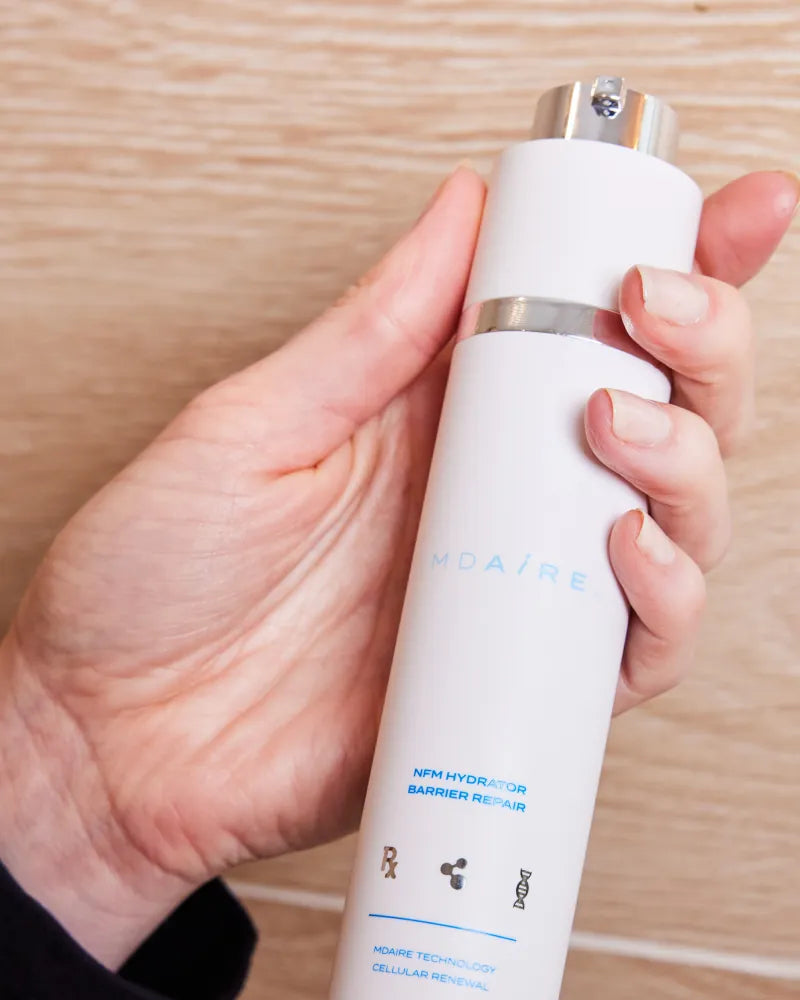 Hand holding NMF Hydrator Barrier Repair by Dr. Stefani Kappel for dai