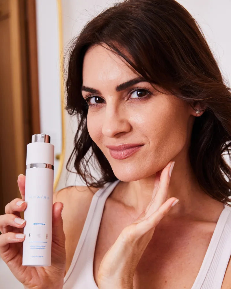 Woman applying Neck Tyte-R moisturizer to neck with white bottle and s