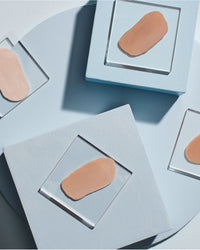 Colorescience Sunforgettable® Total Protection® Face Shield Flex SPF 50 tinted swatches on clear blocks in gallery position 1